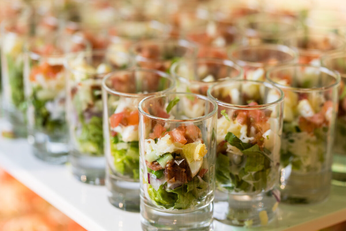 Mini salads served in shot glasses.