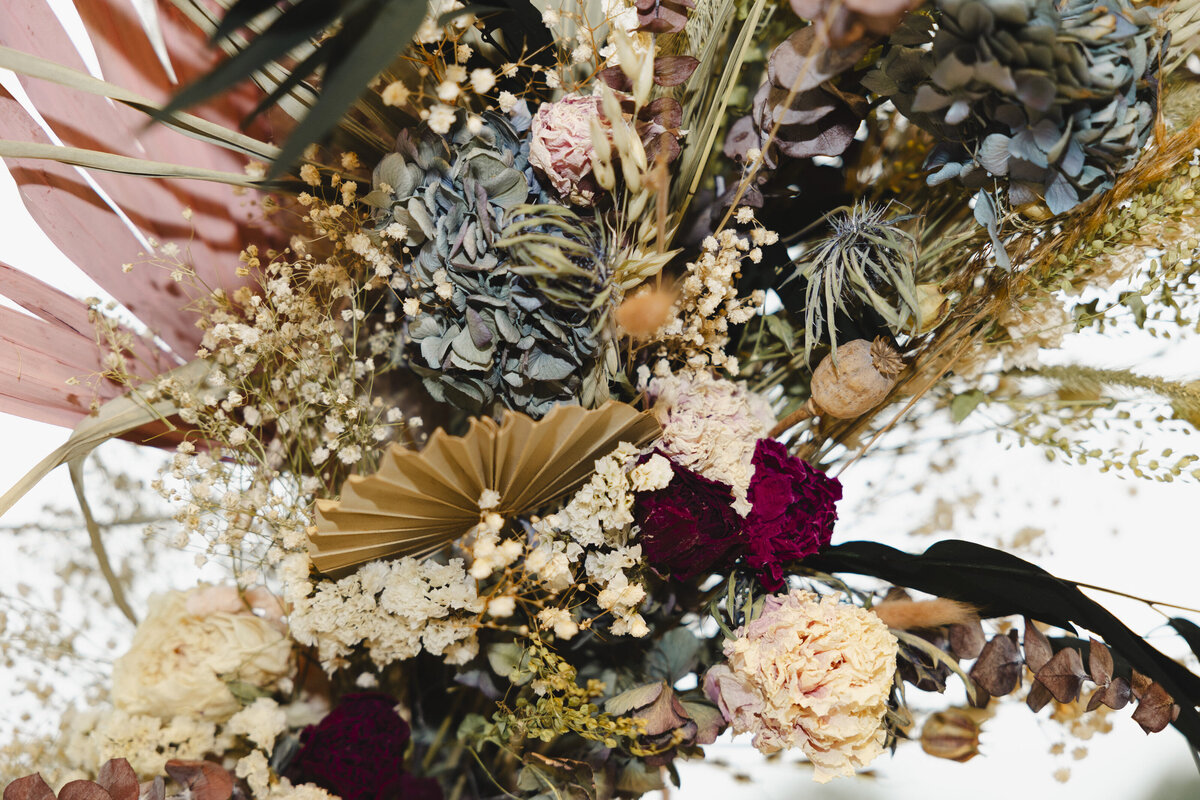 A bold floral arrangement laid out on a table 