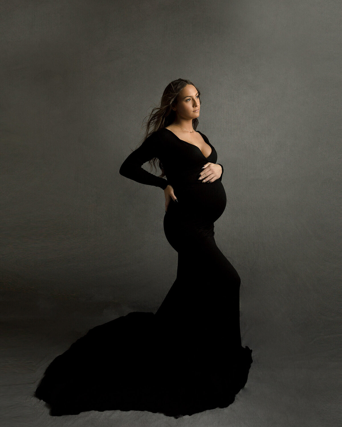 Pregnant Mom in a black maternity gown.