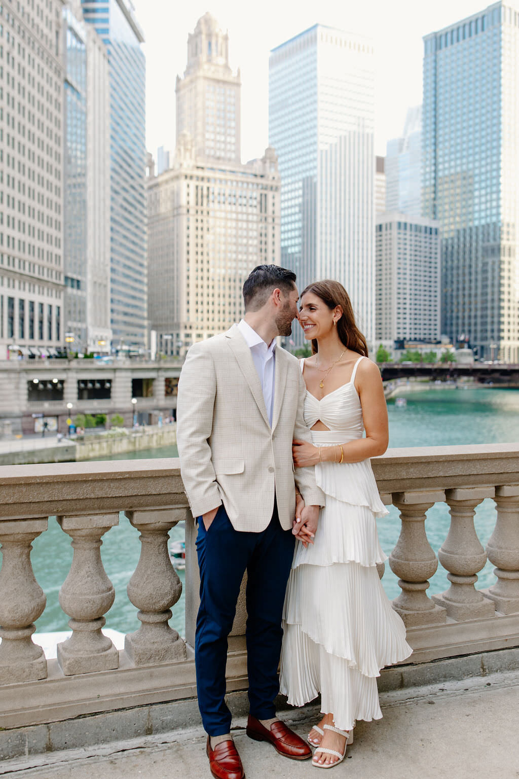 An engagement photography session at The Wrigley Building and North Ave Beach in Chicago, Illinois - 10