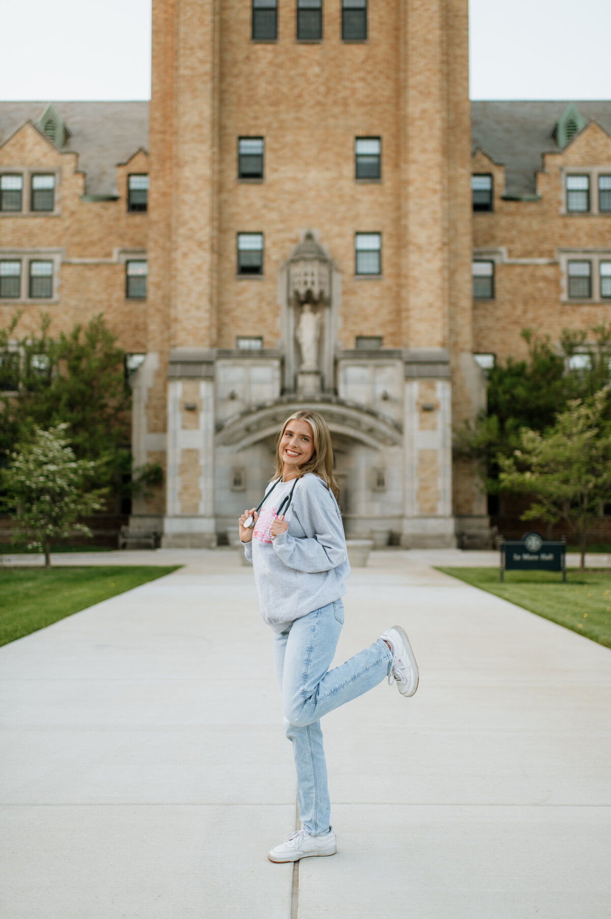 College graduation photos on campus walkway