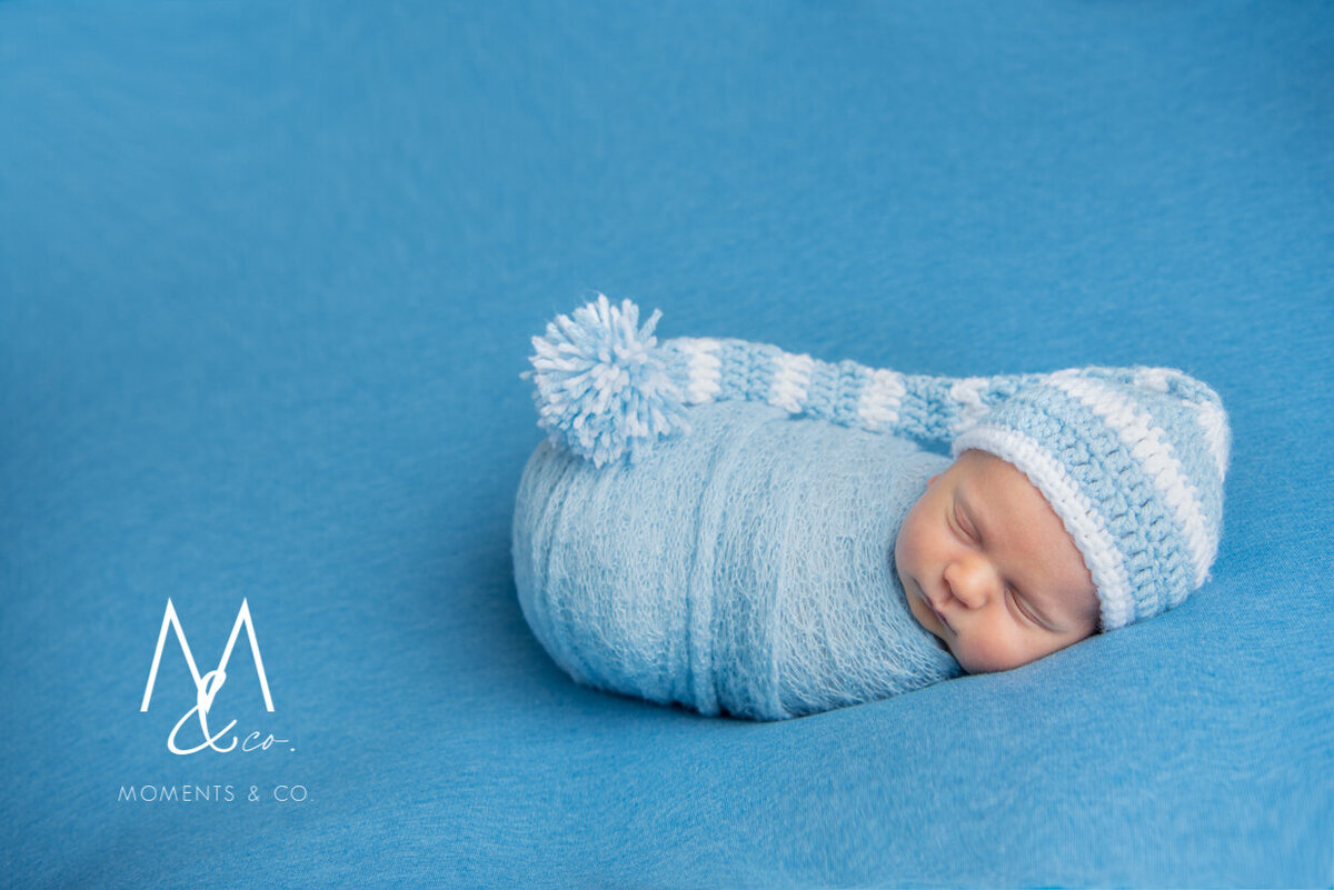Newborn-Baby-Boy-Wrapped-in-Blue-in-Bonnet-3