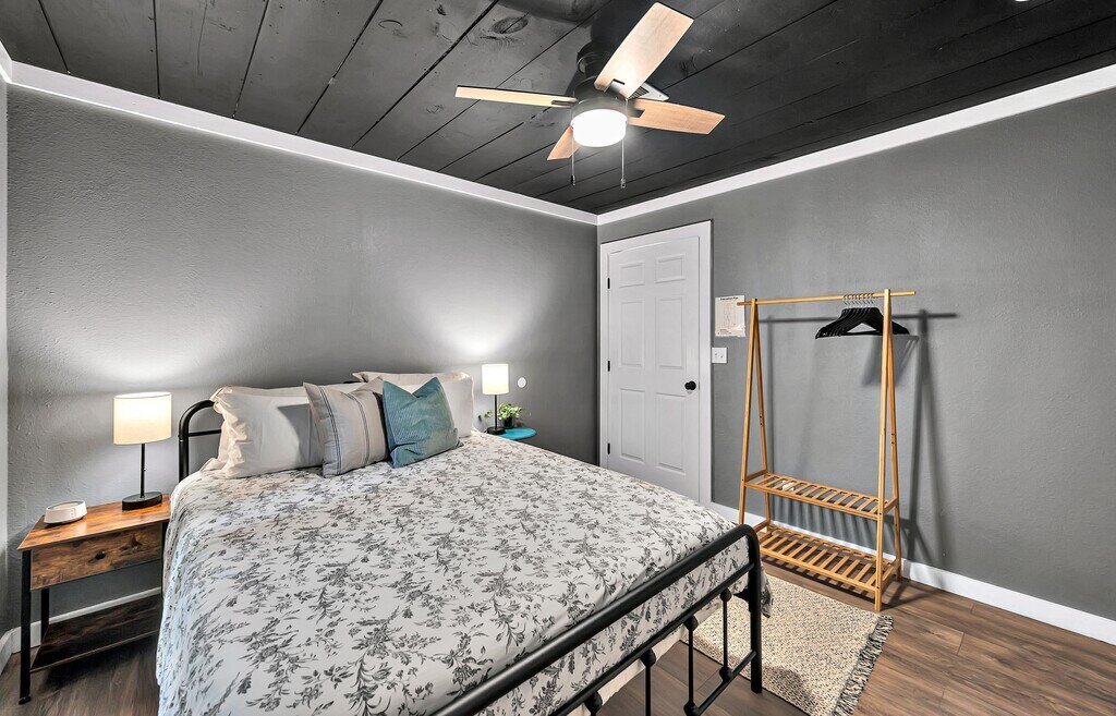 Bedroom with Queen bed in this two-bedroom, one-bathroom vacation rental house for five located just 5 minutes from Magnolia, Baylor, and all things downtown Waco.