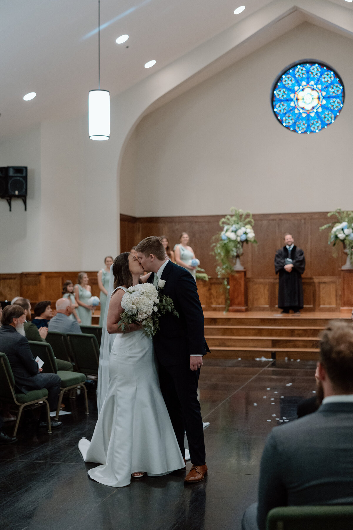 Bride and Groom share a kiss after ceremony