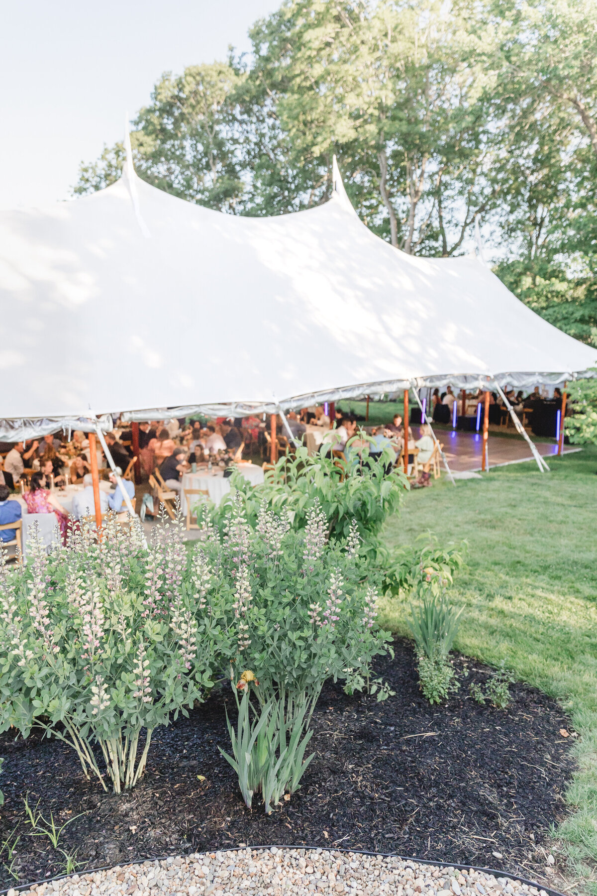 A sail cloth wedding tent in a garden