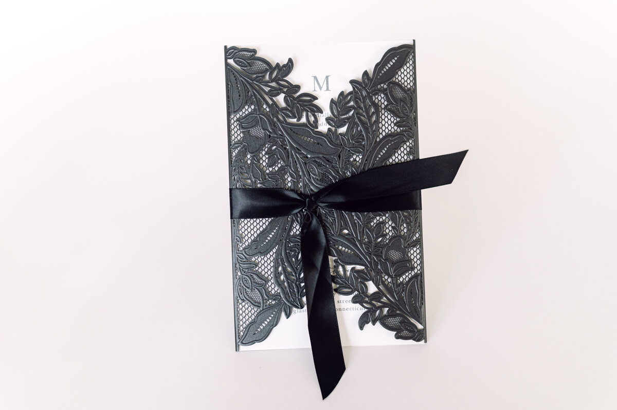 Jane Osler Creative wedding invitation with black lace wrap