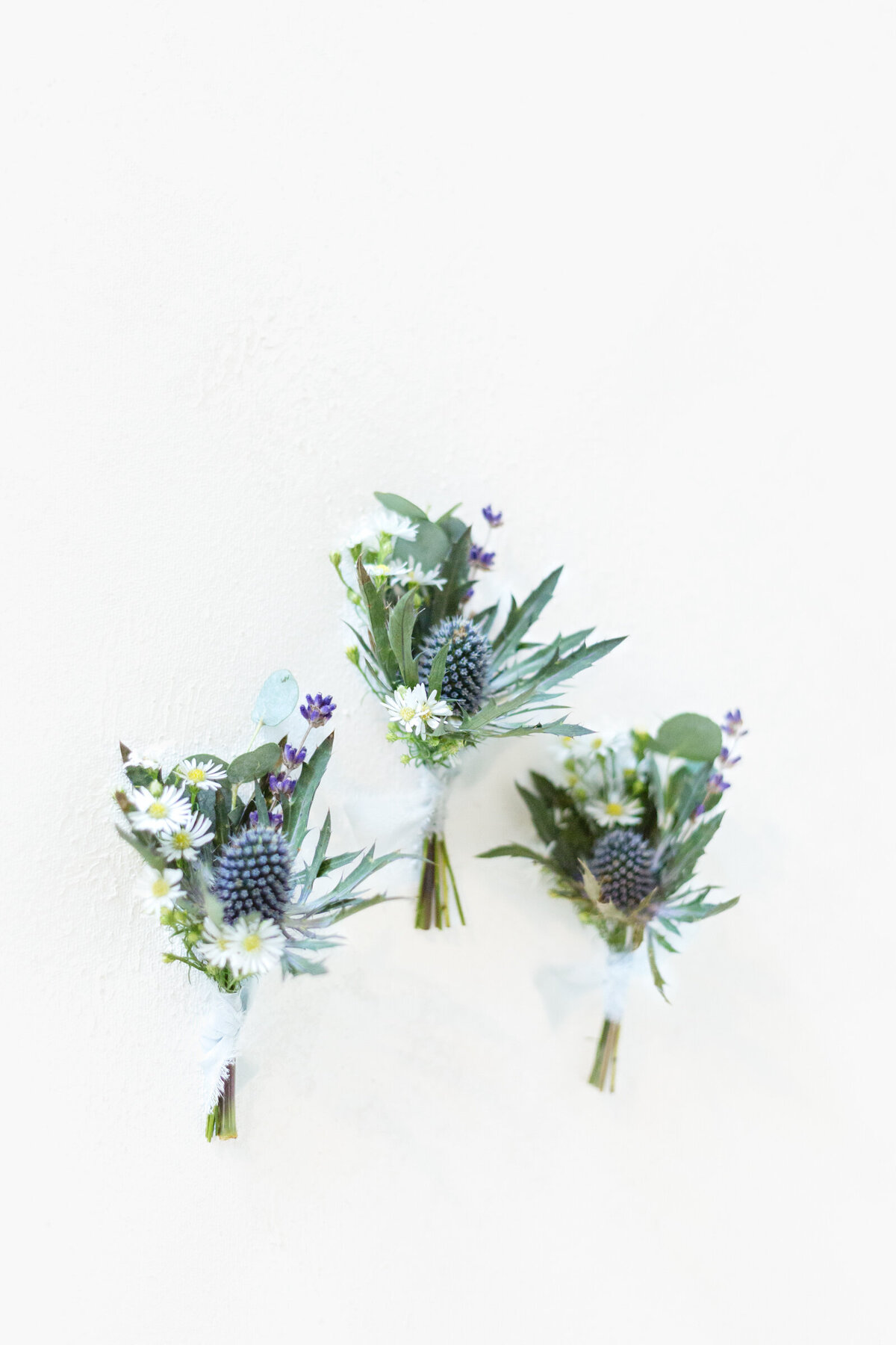 blue and white boutonnieres