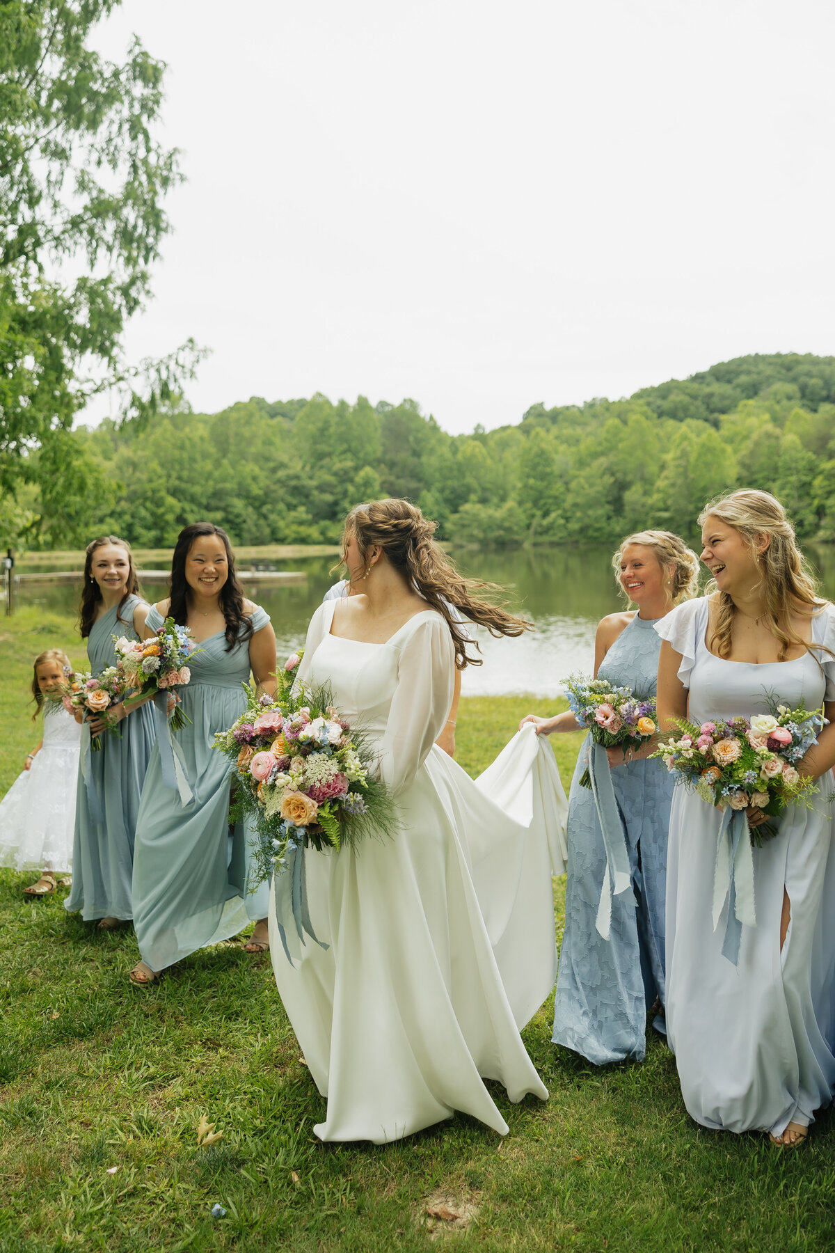 Bride and bridesmaids with colorful bouquets designed by Abby Grace Florals at Dahlonega GA wedding