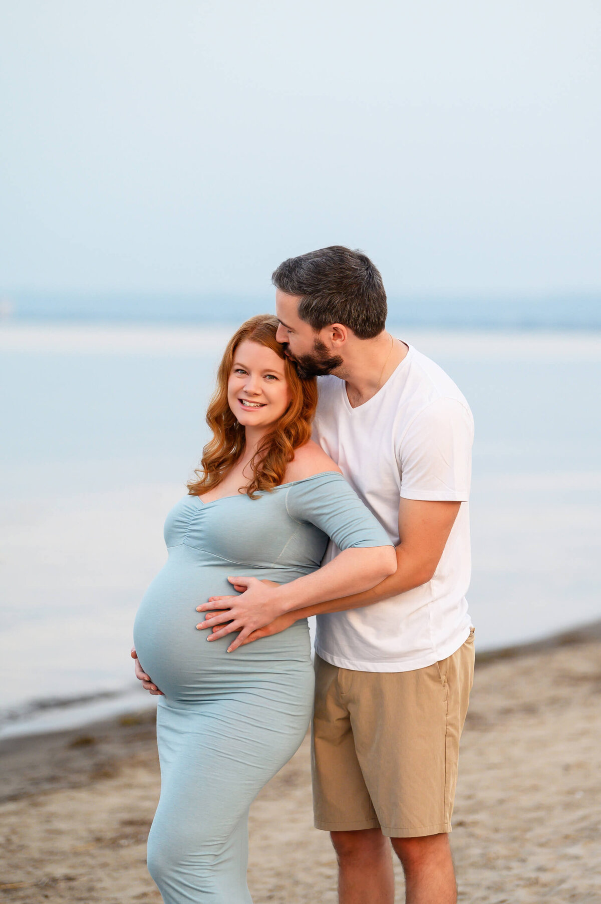 mom and dad for their Toronto Beach Maternity Photos