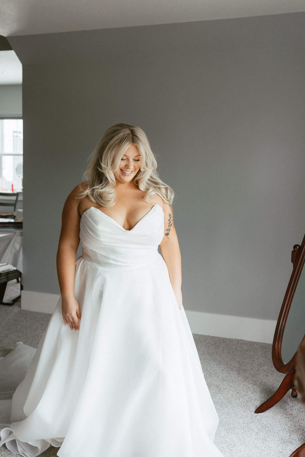 A bride smiling, representing bridal makeup done by Looks with Libby.