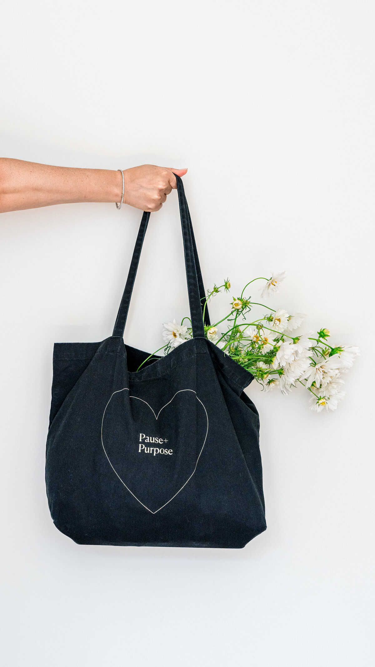 Black tote with white flowers