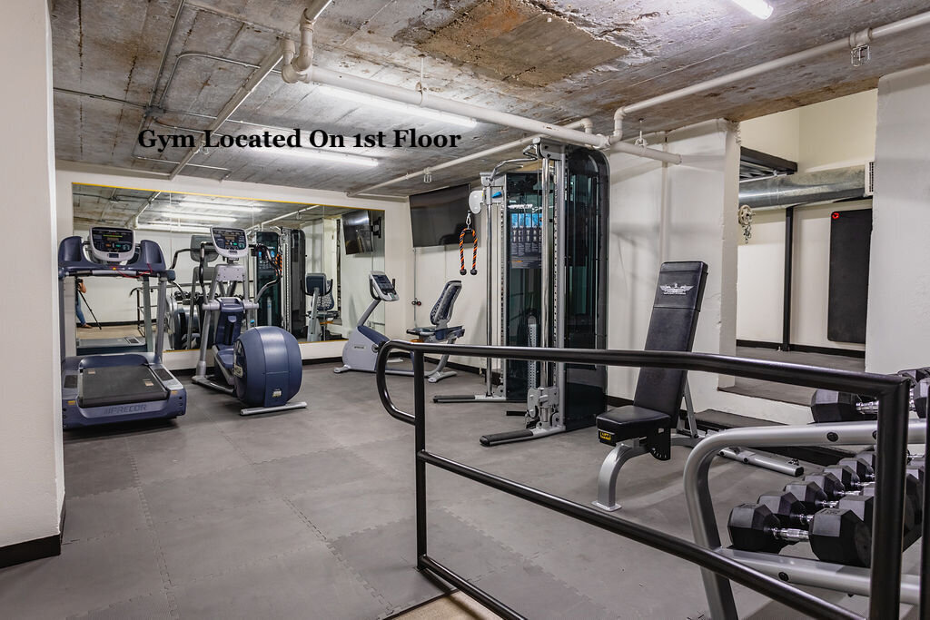 Behrens Gym with weights and exercise machinery located in this top floor two-story industrial condo in the historic Behrens building with skyline views, fully stocked kitchen and room for 6 in downtown Waco, TX.