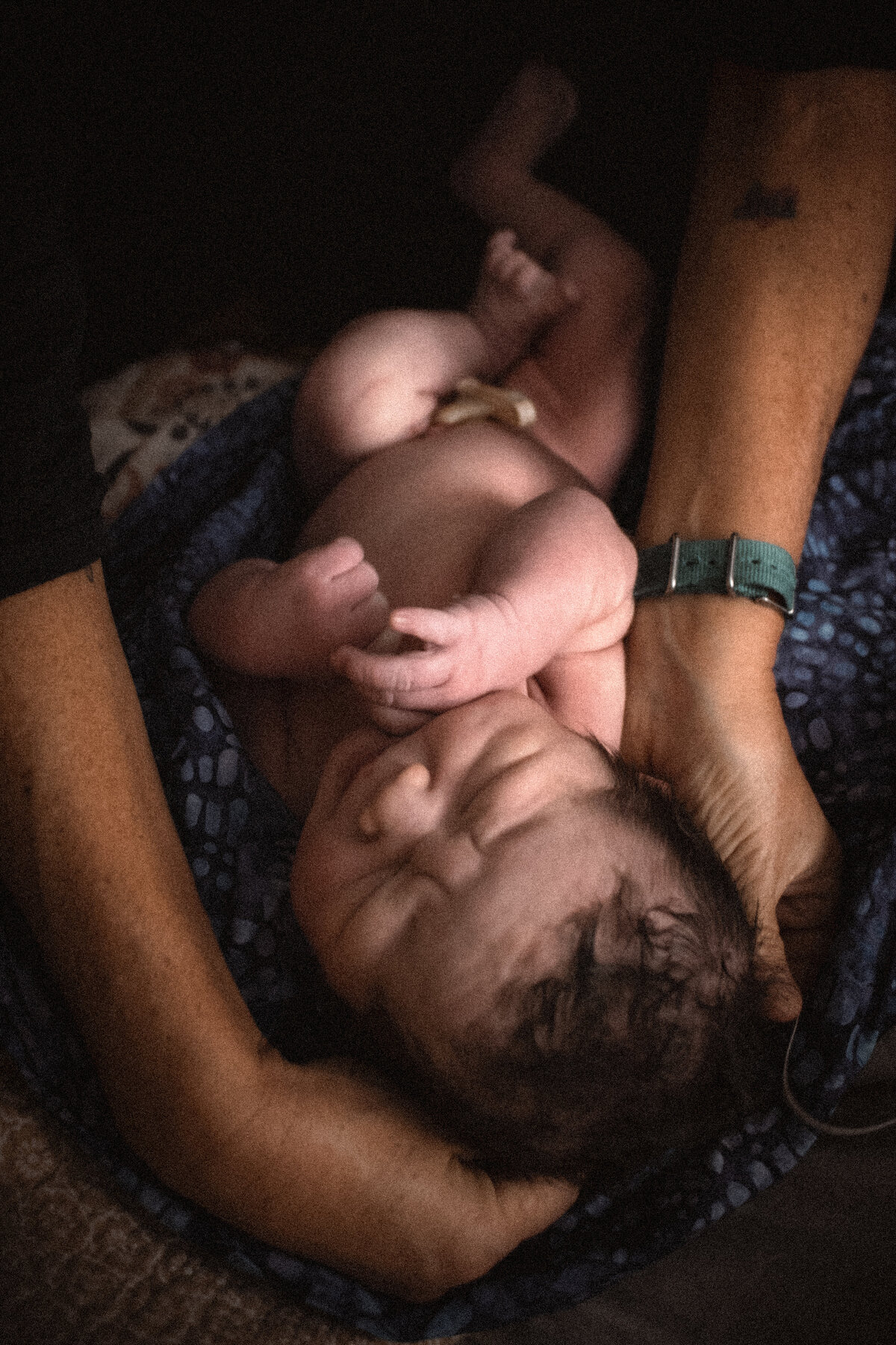 homebirth midwife measuring newborn baby