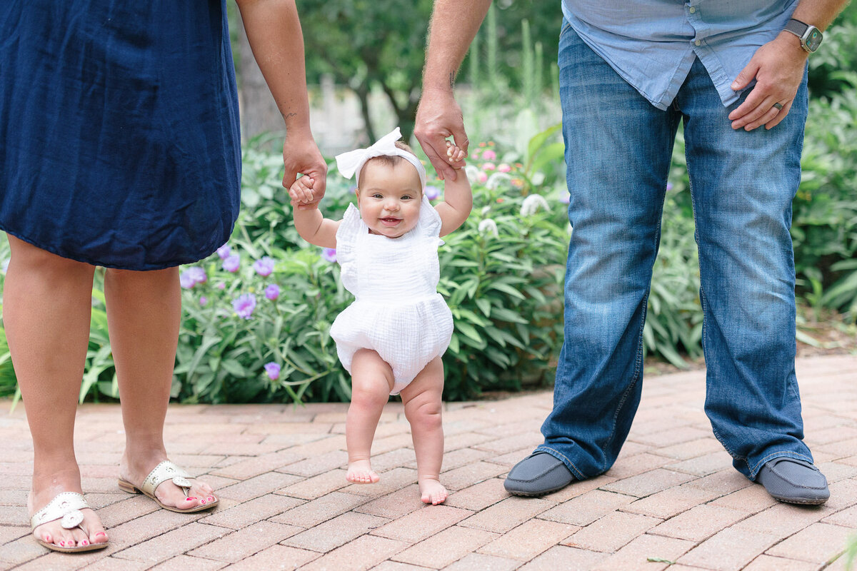 New mom and dad holding their newborn baby during their northern kentucky newborn photography session with missy marshall