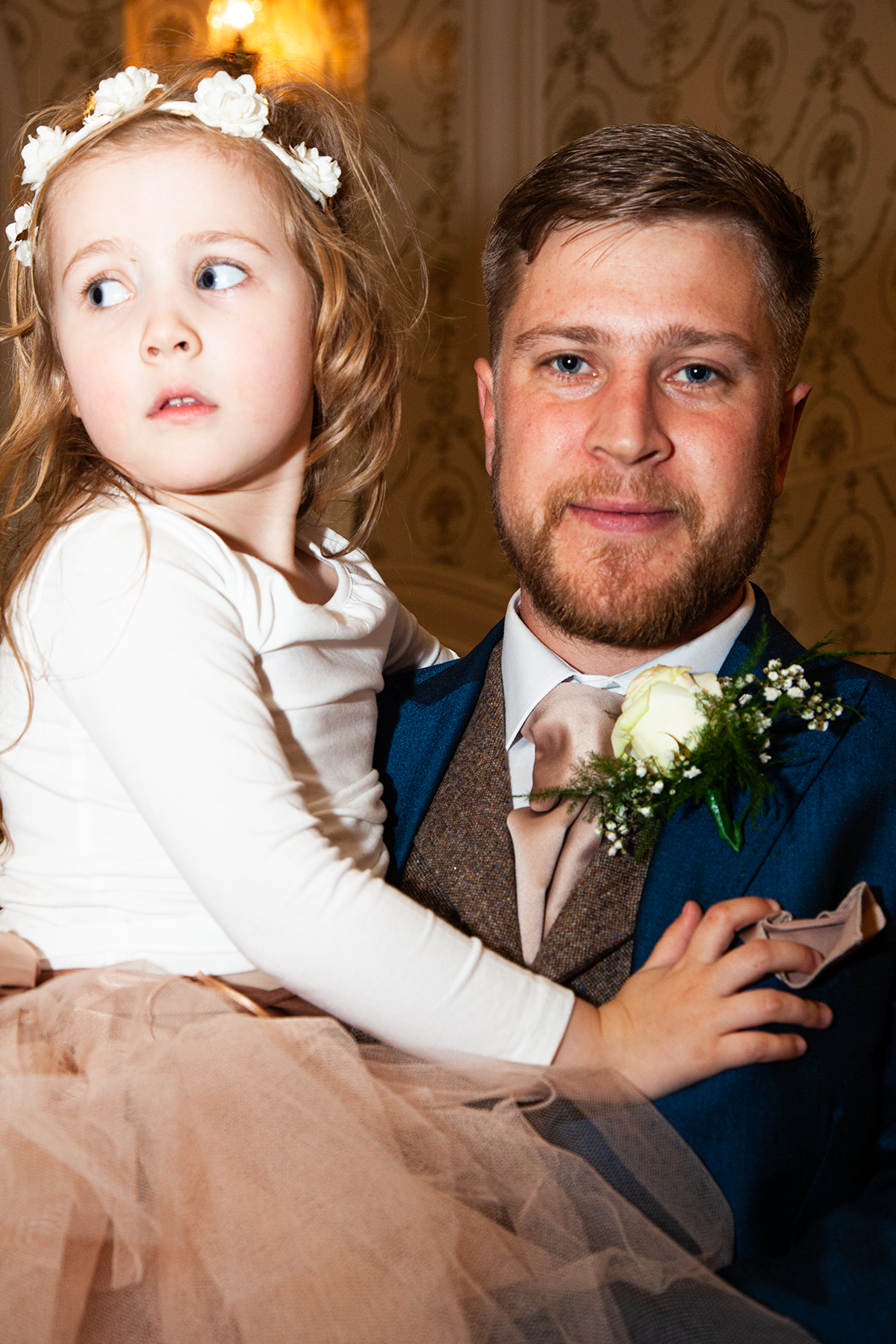pro-story-photography_groom-holding-flowergirl_duke-of-cornwall-hotel_plymouth