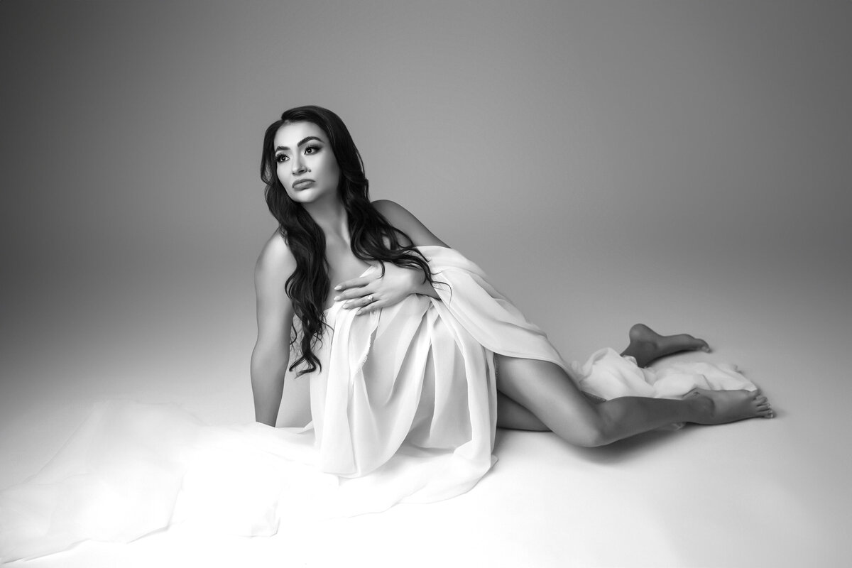editorial maternity portraits of woman in chiffon fabric for maternity photographer in phoenix 