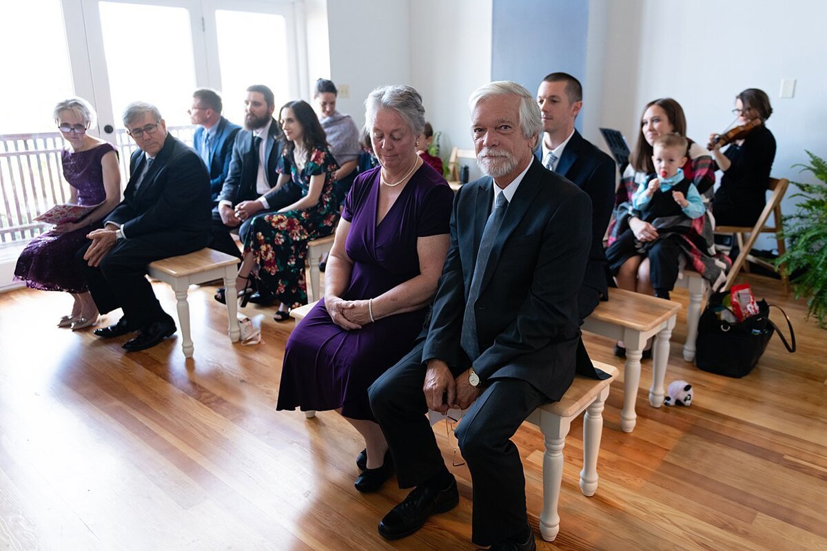 Wedding Guests await the start of a self-uniting Quaker wedding ceremony in Pittsburgh, PA