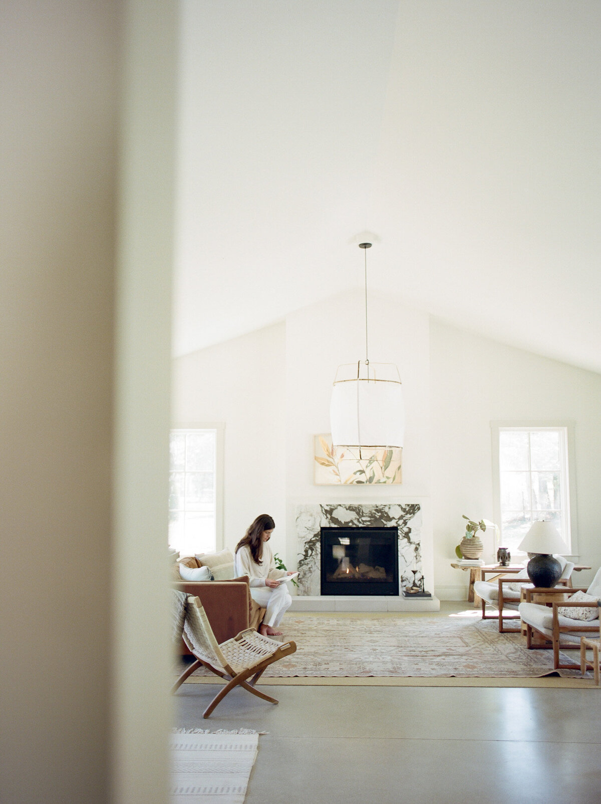 relaxed designer works at Fernhaus, lifestyle film interior photography, branding photoshoot for designer