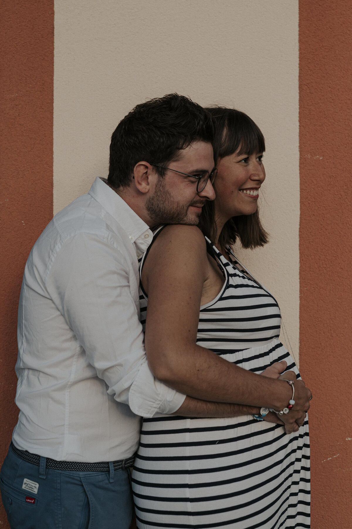A couple hugging during a photoshoot in the French Alps.