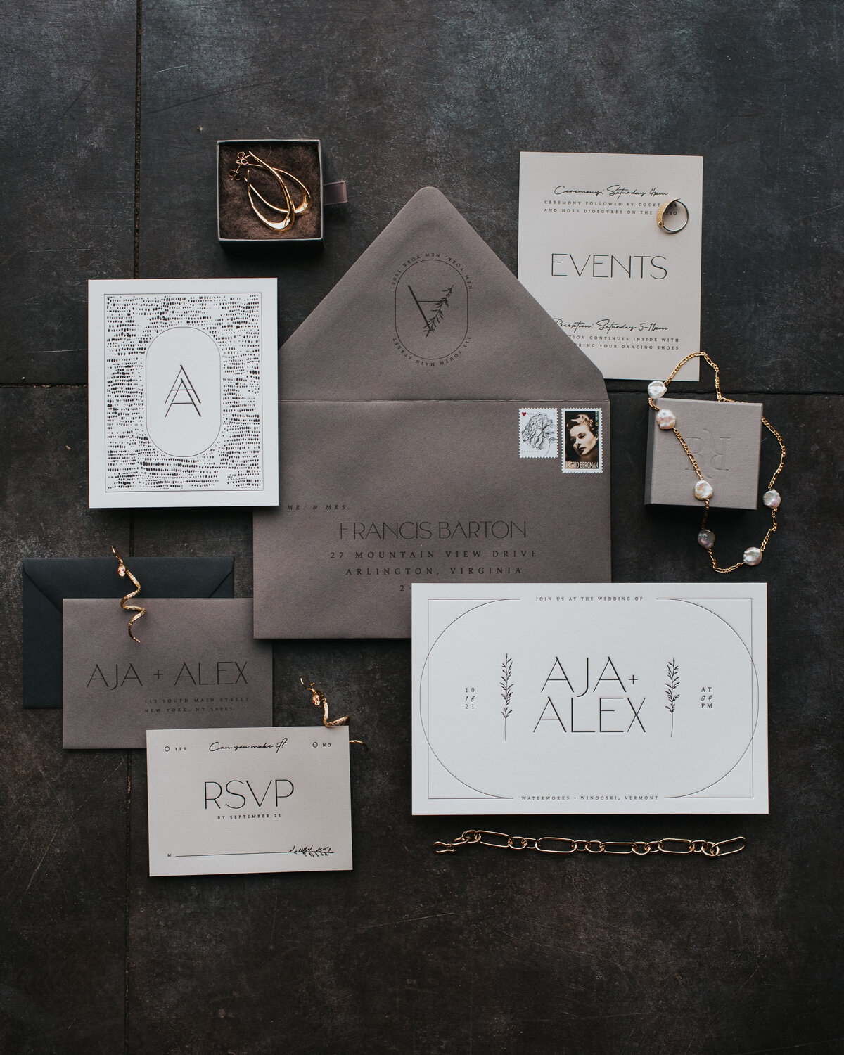 gray and white modern wedding invitation with rack and ruin jewelry
