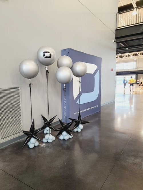Minimalistic black and white balloon arrangement for a modern event.