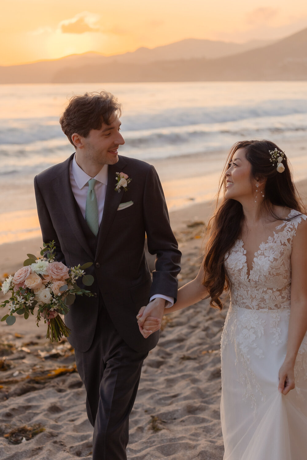 candid Wedding Photos of couple holding hands on beach in Pismo Beach 