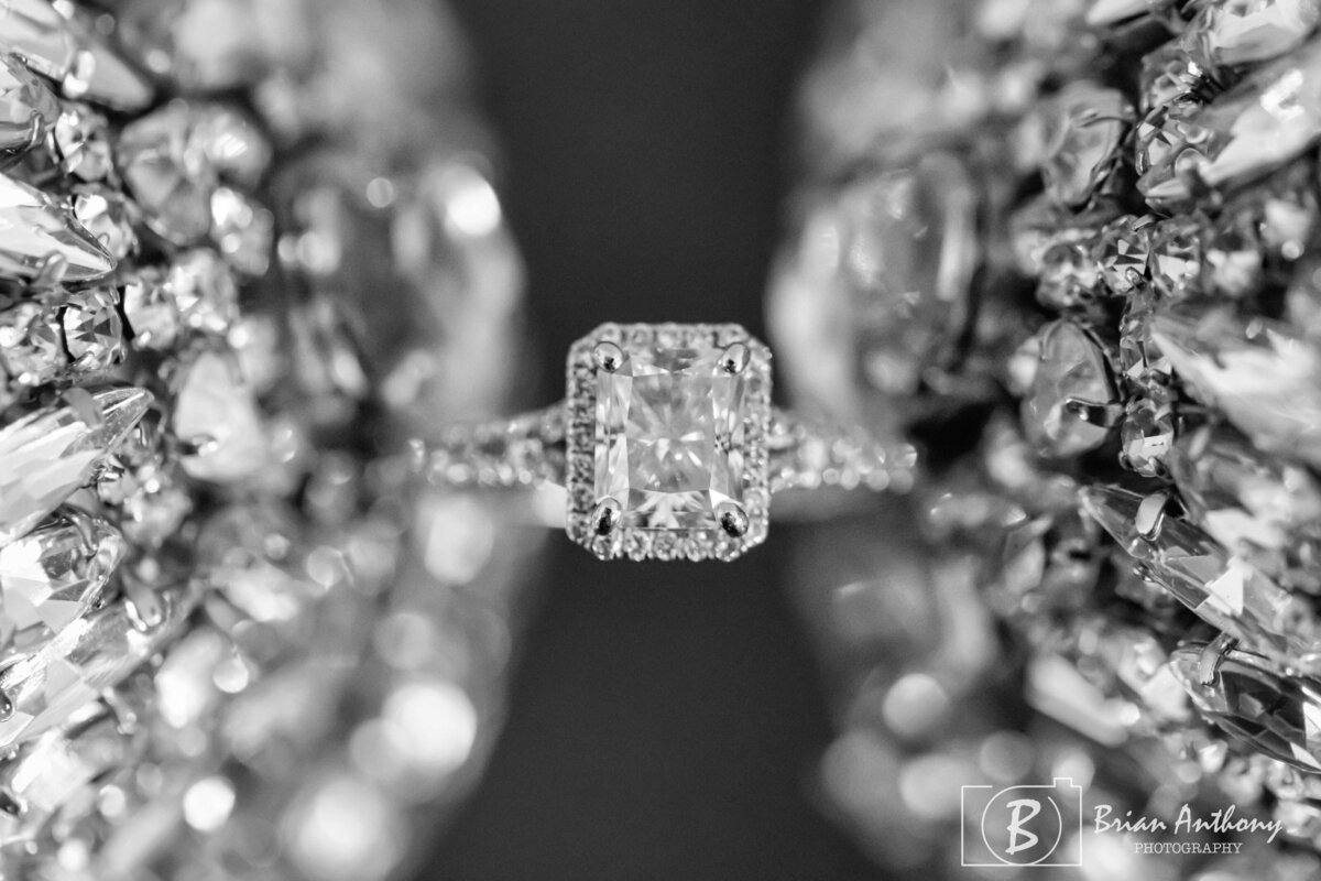 Beautiful engagement ring with a dazzling diamond set against a shimmering background.