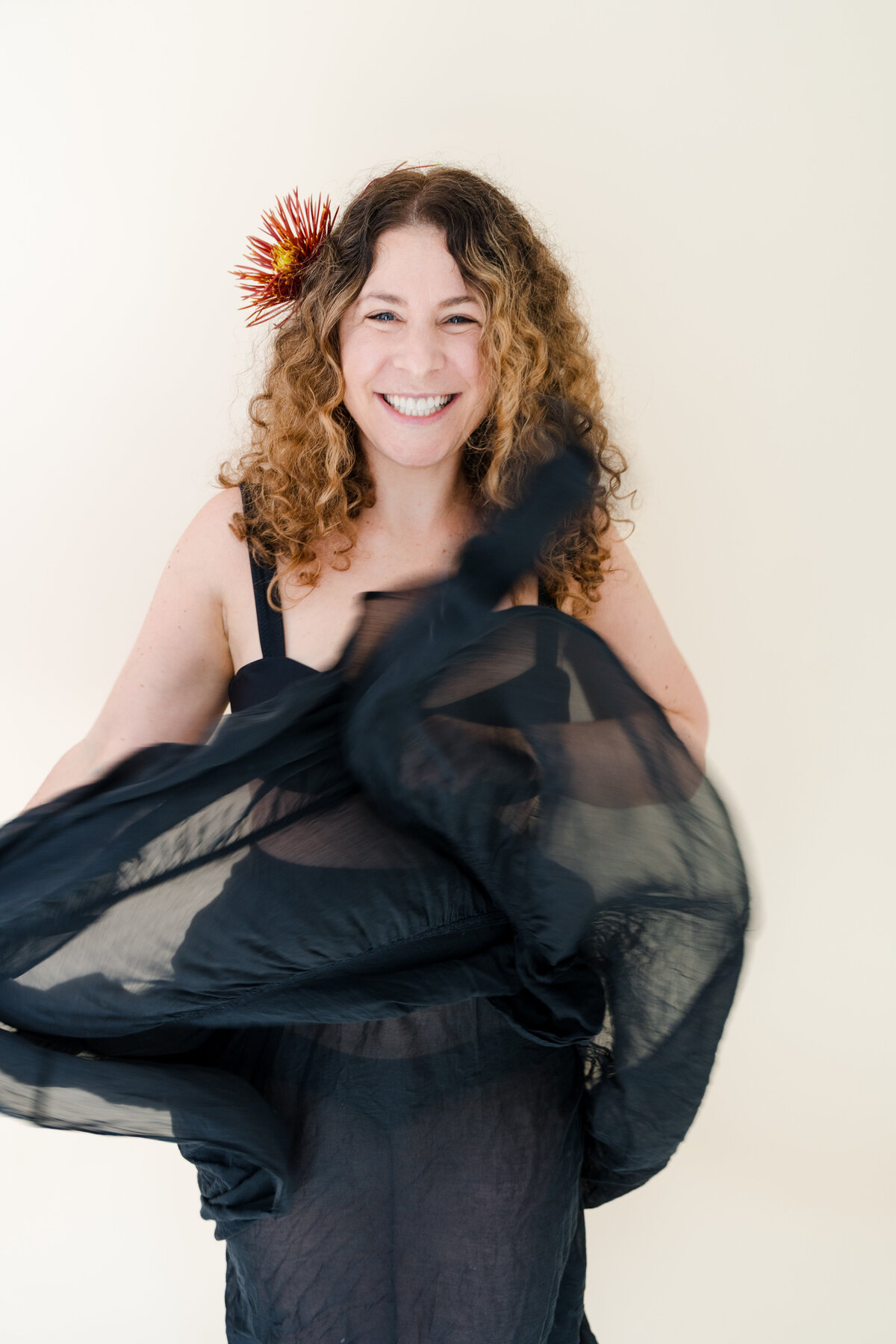 portrait of woman lifting skirt while dancing