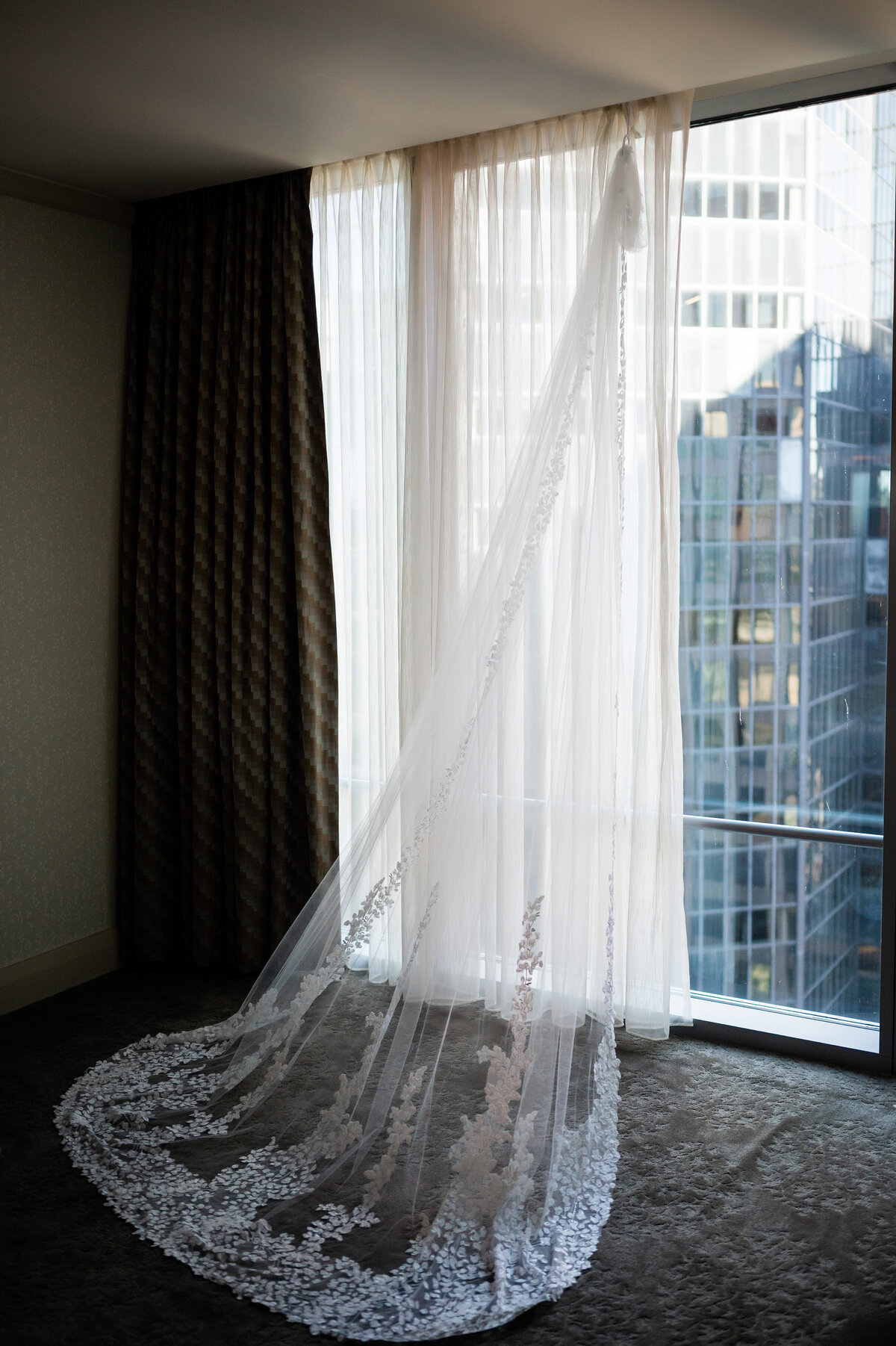 wedding veil hanging in window