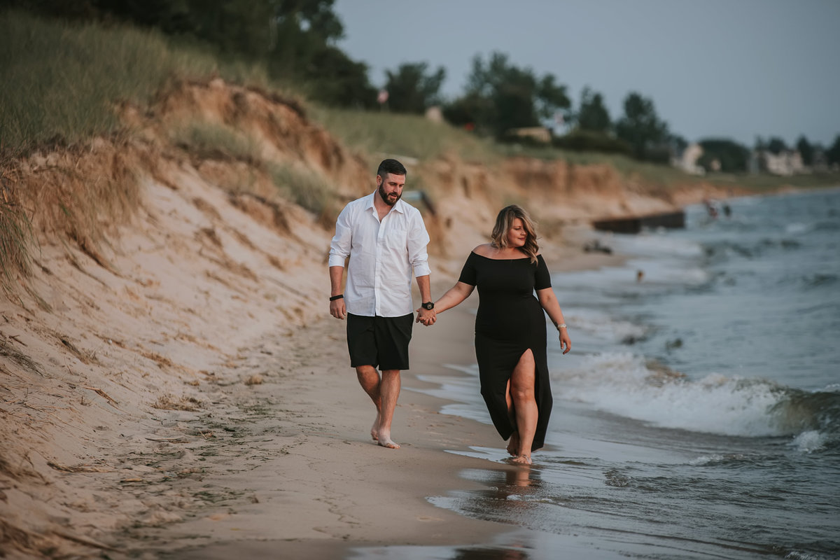 couple walking on beach lake michigan grand haven