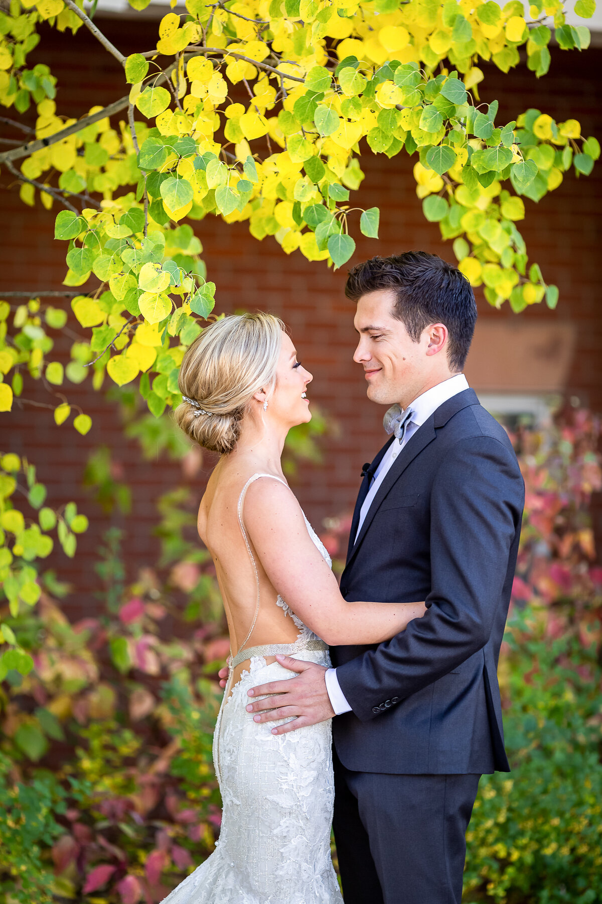 Bride and Groom Embrace with Fall Color, Aspen