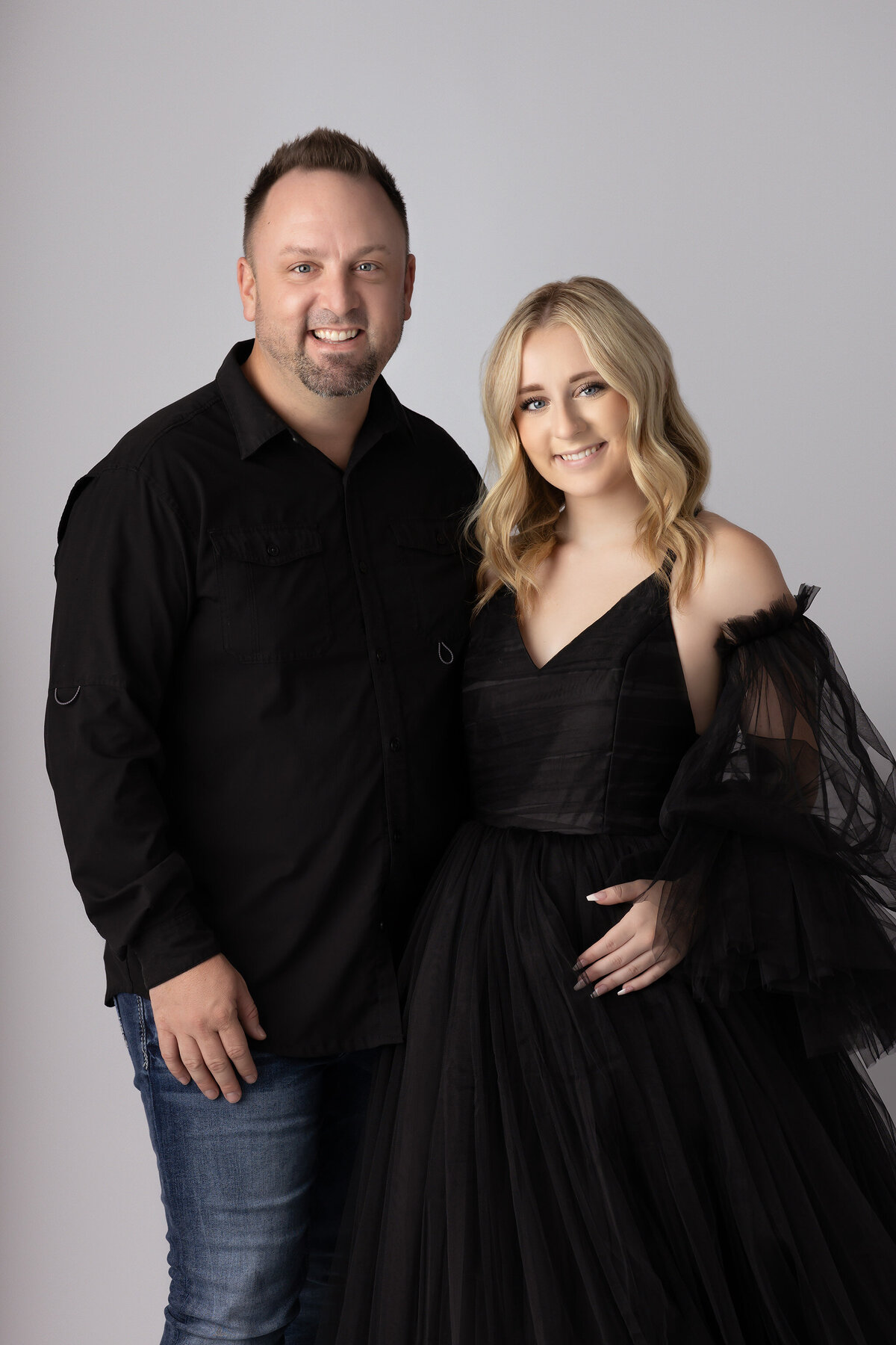 Father and daughter in black attire, captured in a Dallas family portrait session.