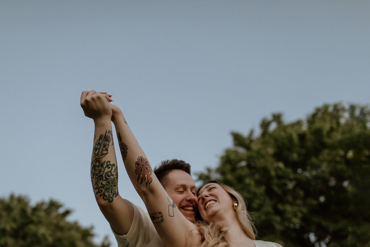 A playful and candid engagement session at Kimbell Art Museum. Captured by Fort Worth Wedding Photographer, Megan Christine Studio