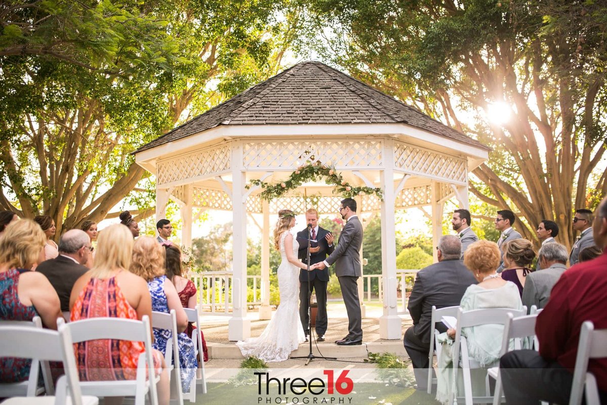 Bride and Groom exchange vows at wedding ceremony