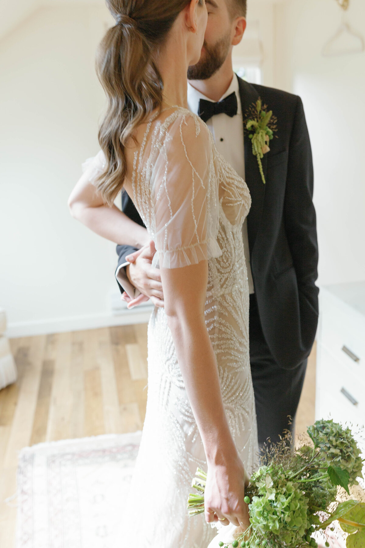 Couple kissing in the Griffin House bridal suite.