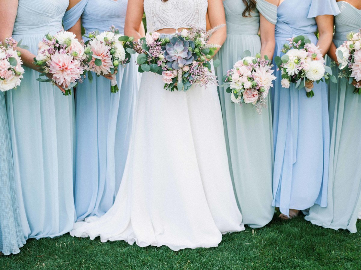 Bride and bridesmaids bouquet designs for this Seattle tent wedding