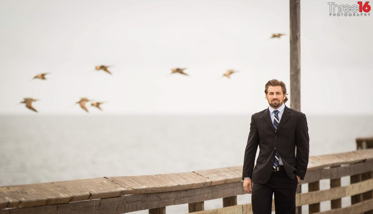 Groom to be awaits his fiance on the Newport Beach Pier
