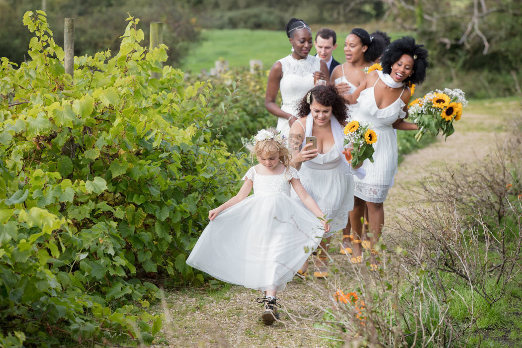 Bridesmaids walking to wedding at River Cottage Devon