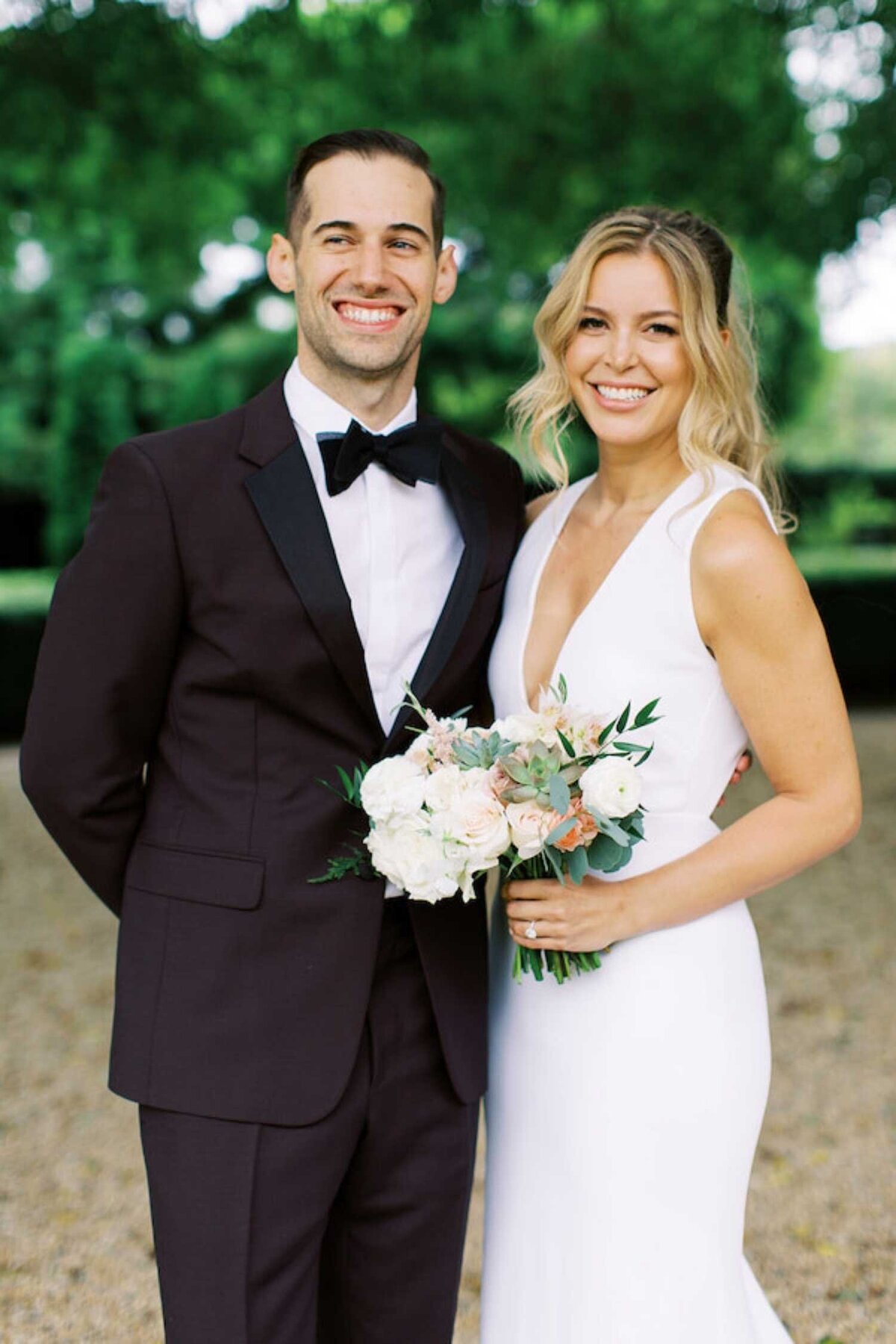 Modern bride and groom in black tie attire at a luxury Chicago outdoor garden wedding.