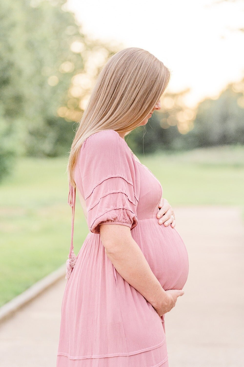 expecting mom holding belly during Woodbridge, VA maternity mini session