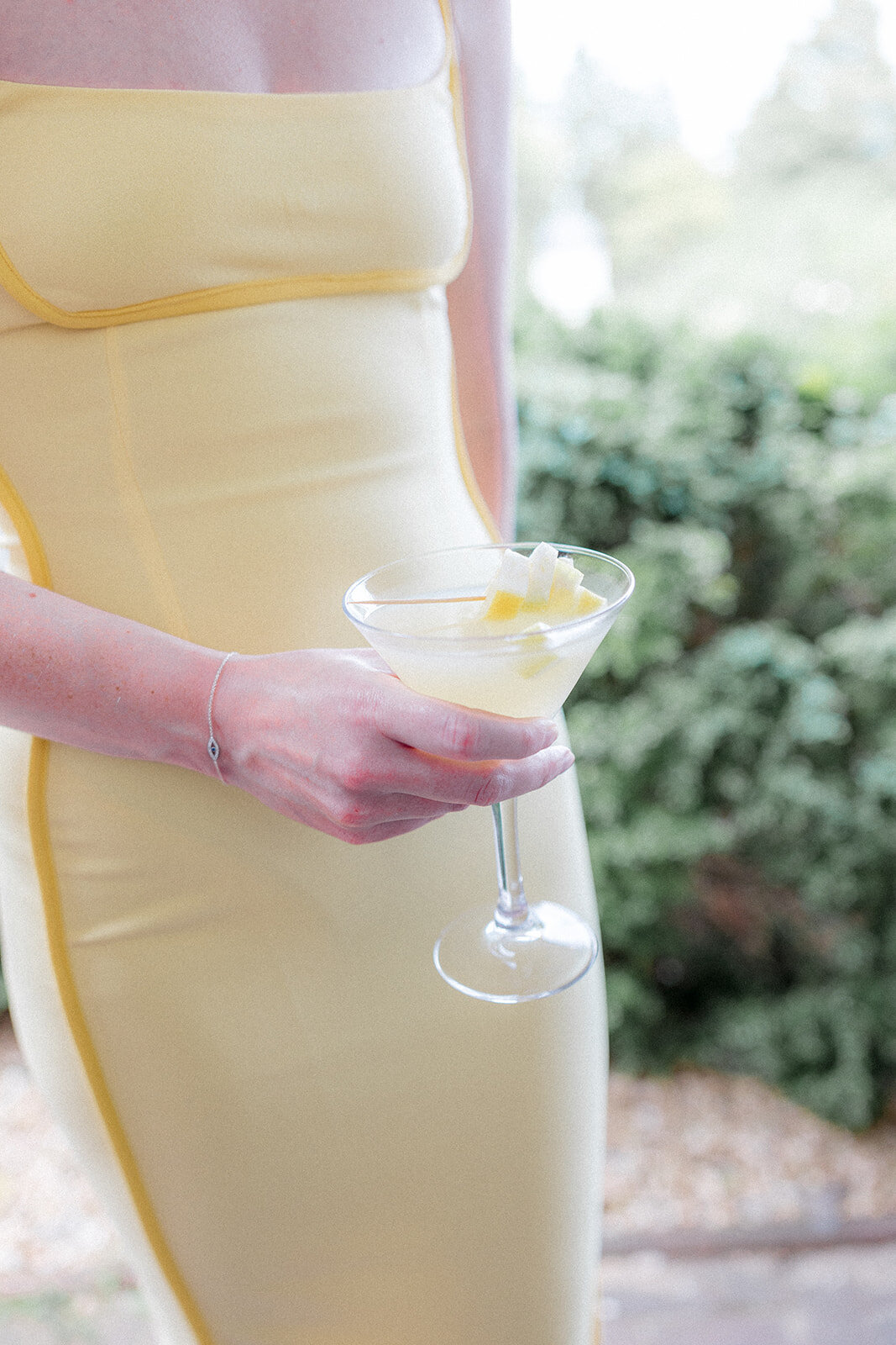 Wedding guest holding a cocktail