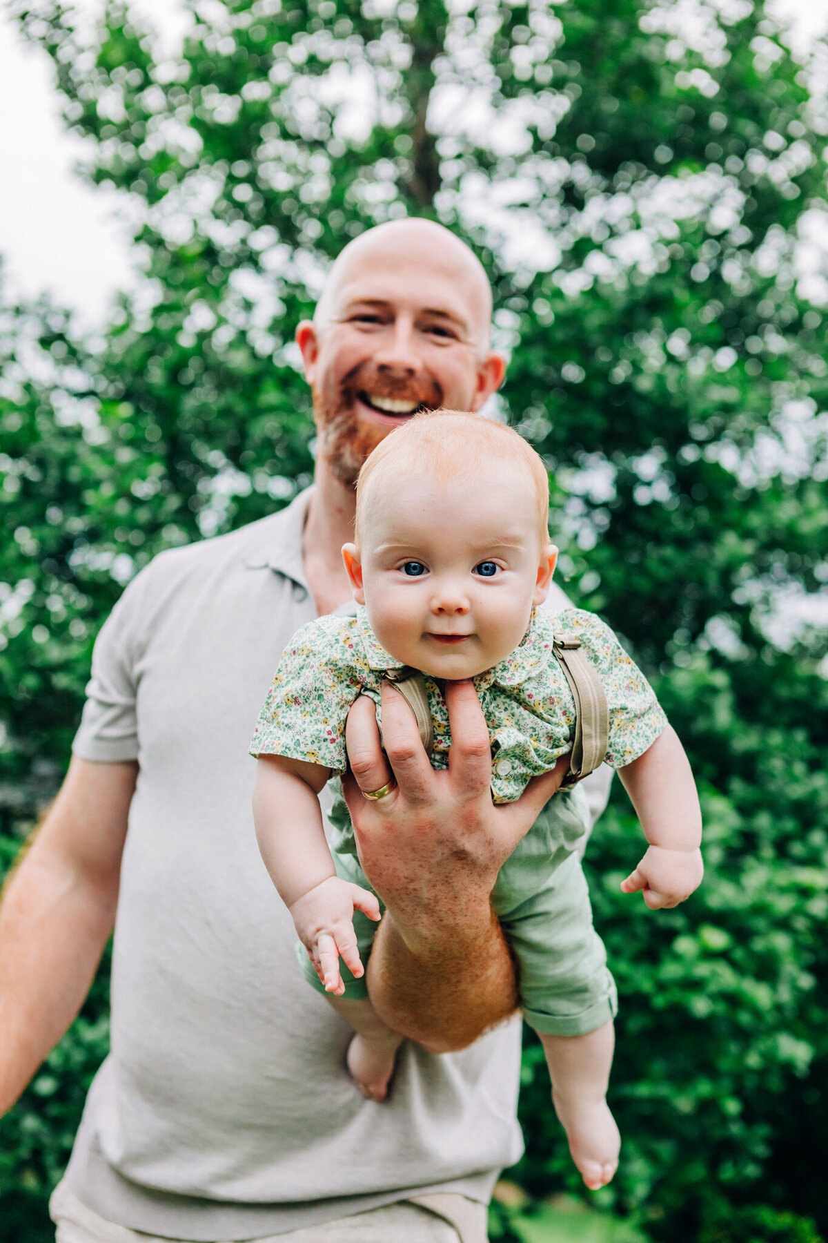 dad-holding-baby-on-arm