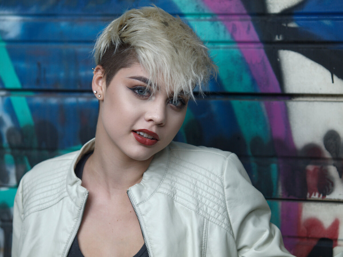 girl with graffiti outdoor daytime portrait