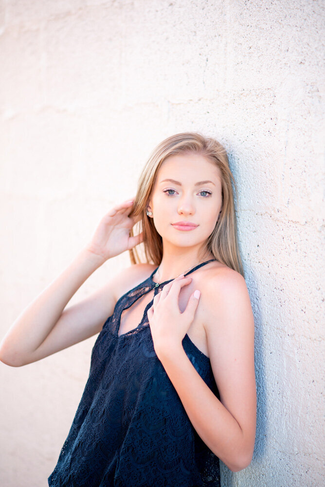 high-school-senior-girl-white-backdrop-parker