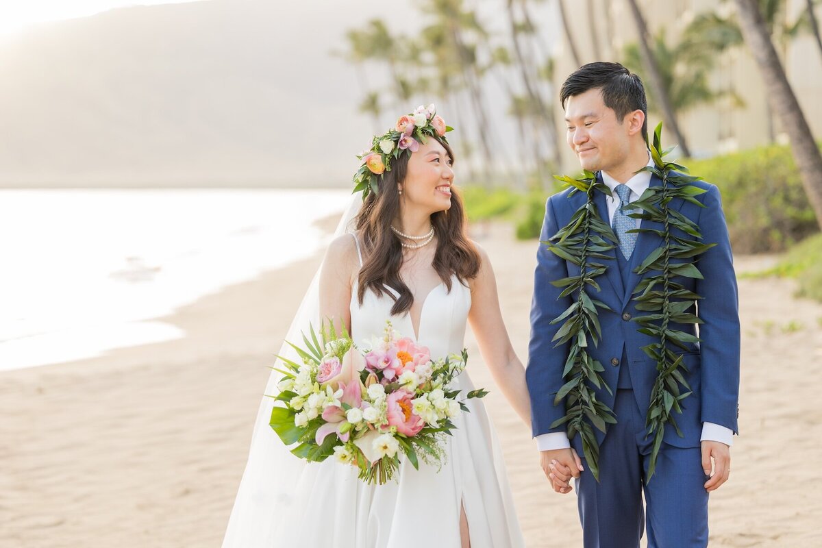 Maui Wedding Photography of bride and groom walking on the beach hand in hand