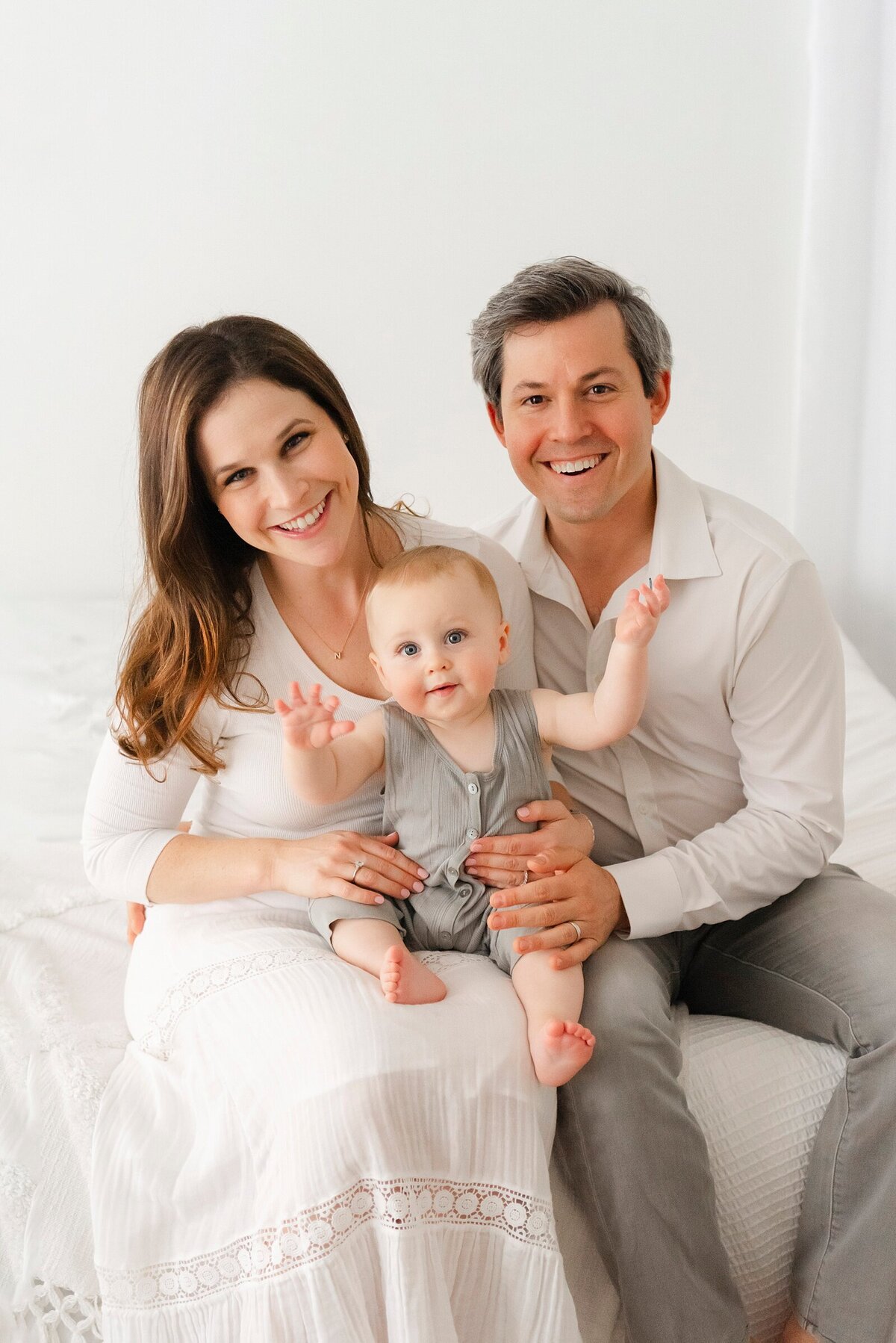 family in studio smiling taken by best boston family photographer​