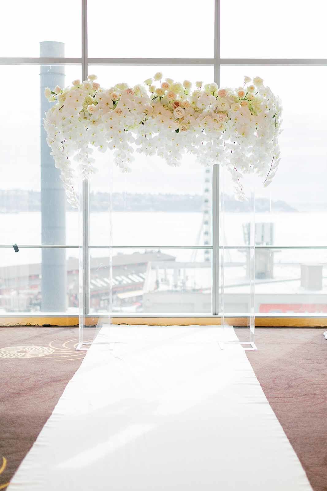 wedding arbor with clear lucite arbor and white orchids