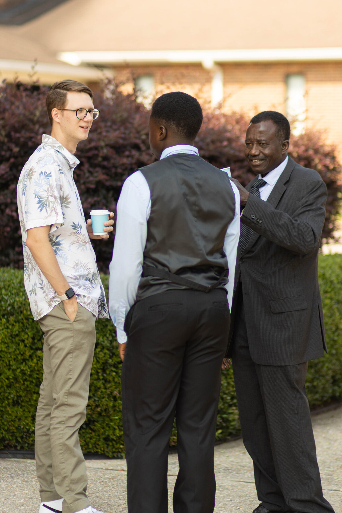 Group of diverse men talking at a non-denominational church in Fayetteville, NC.