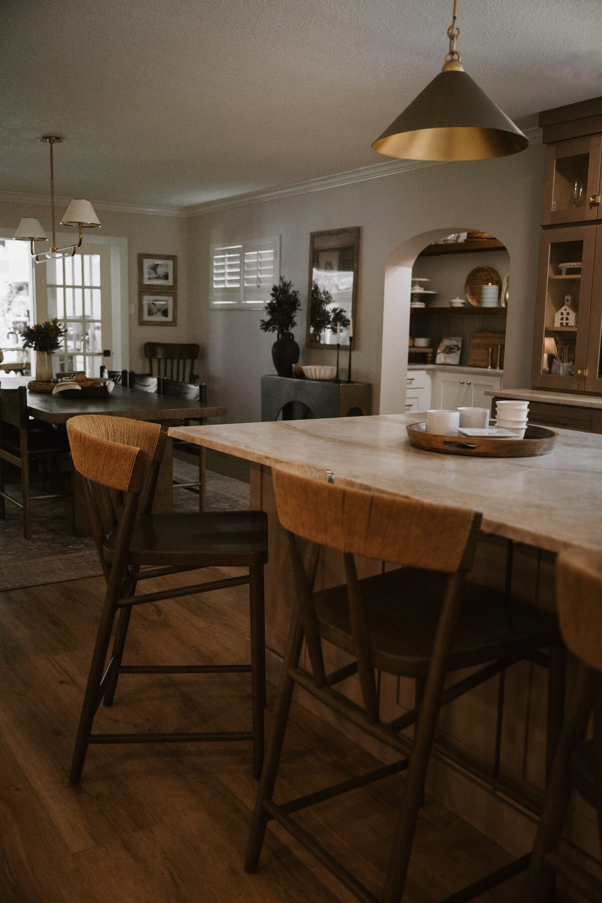dewine design interiors vintage cove trail kitching island and arched pantry doorway