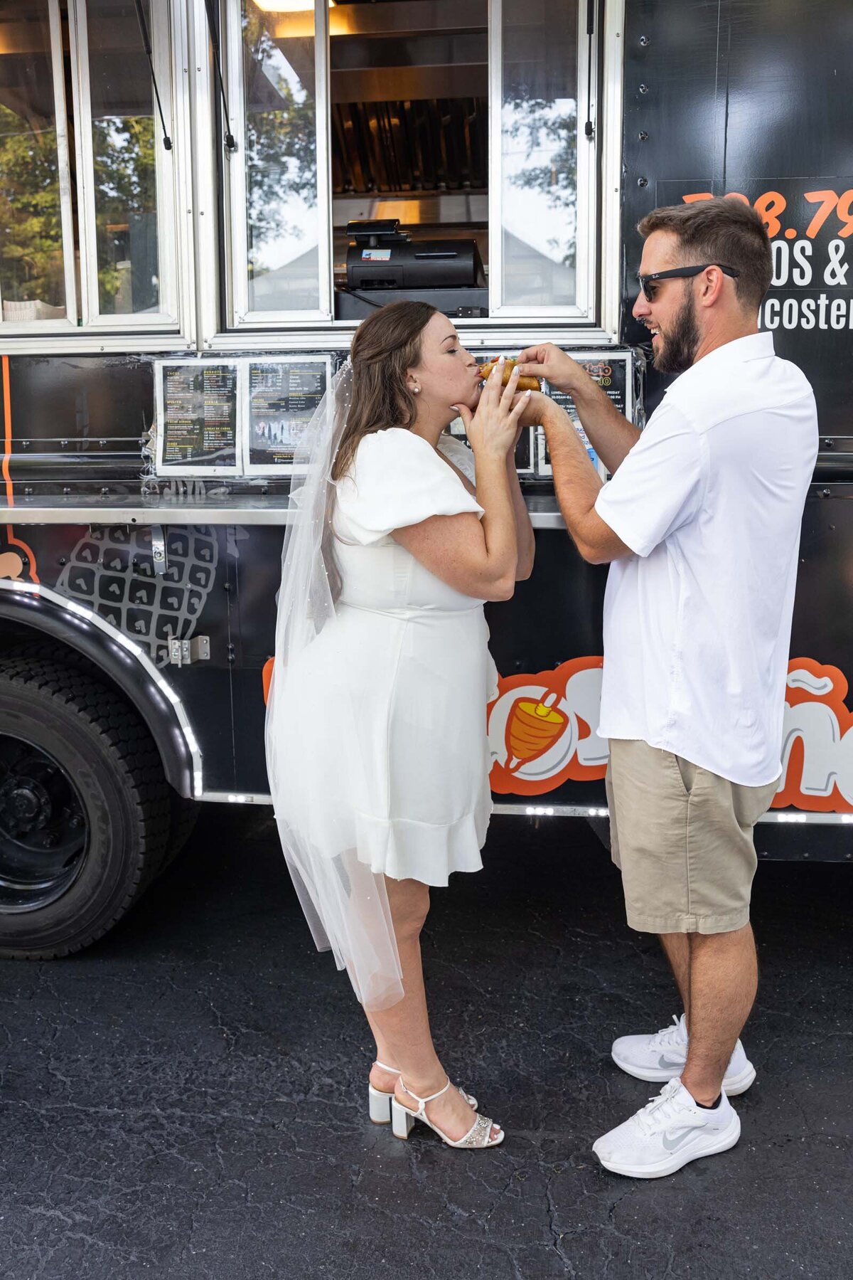 groom-feeds-bride-food-truck-wedding